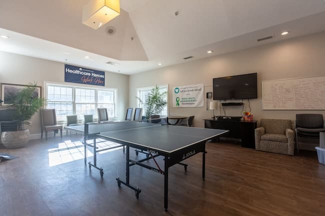 Recreation room with ping pong table and television